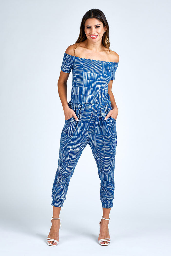 Woman wearing blue and white jumpsuit.