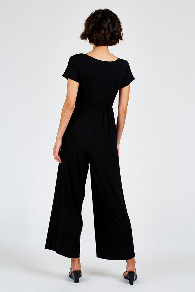 Woman wearing black jumpsuit.