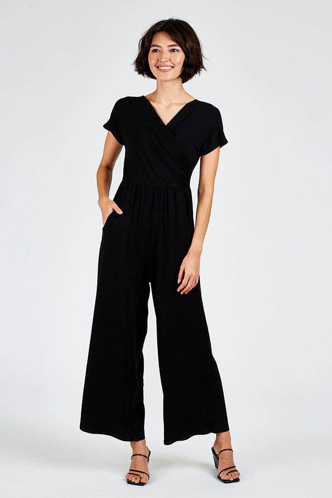 Woman wearing black jumpsuit.