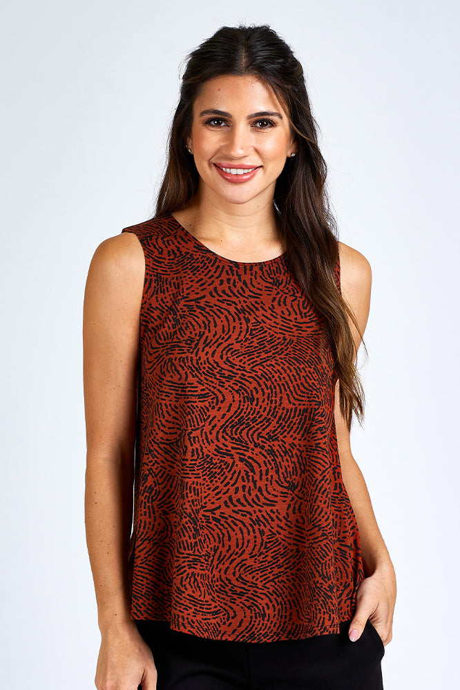 Woman wearing orange and black tank top.
