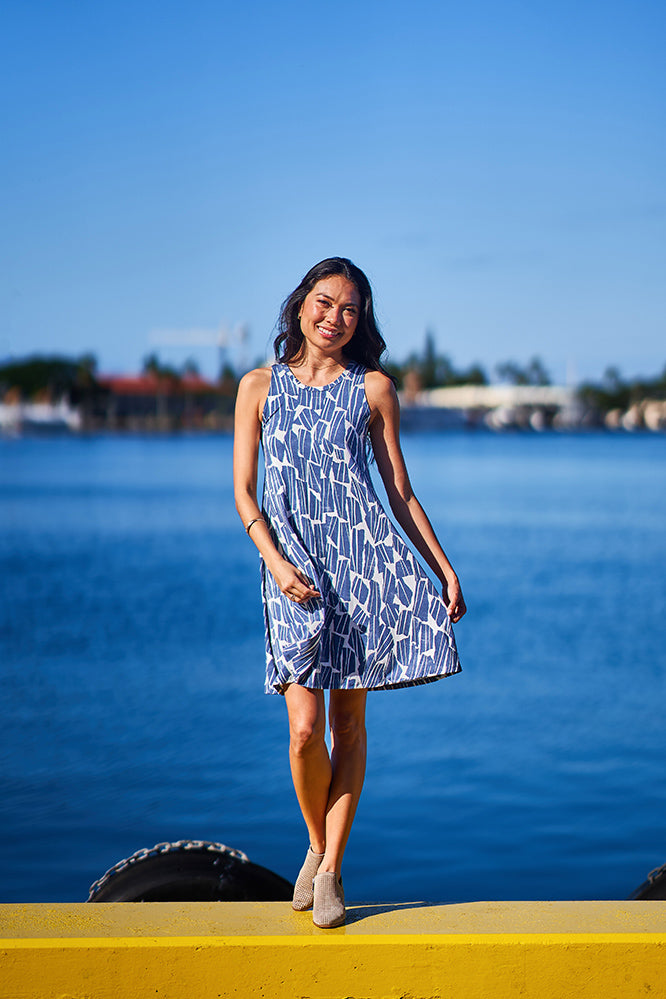Woman wearing blue and white dress.