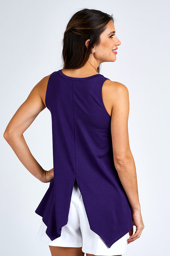Woman wearing a purple tank top.