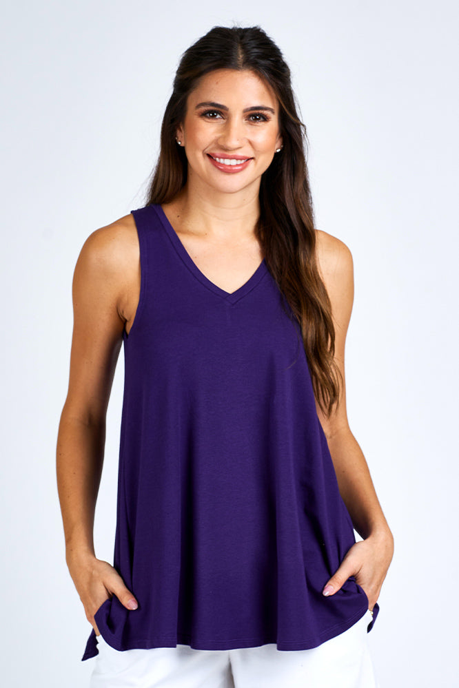 Woman wearing a purple tank top.