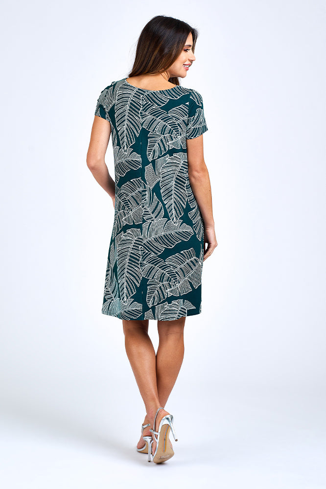 Woman wearing forest green dress.