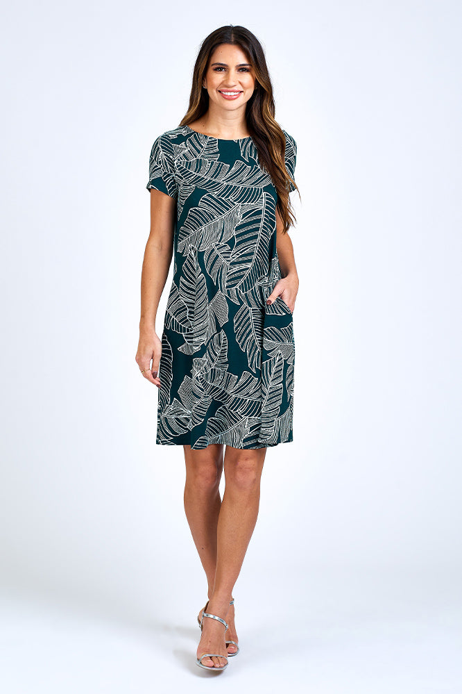 Woman wearing forest green dress.