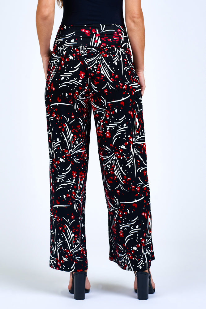 Woman wearing red and black pants.