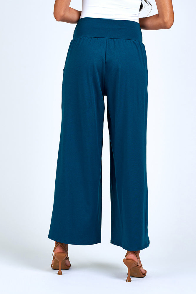 Woman wearing blue wide leg pant.