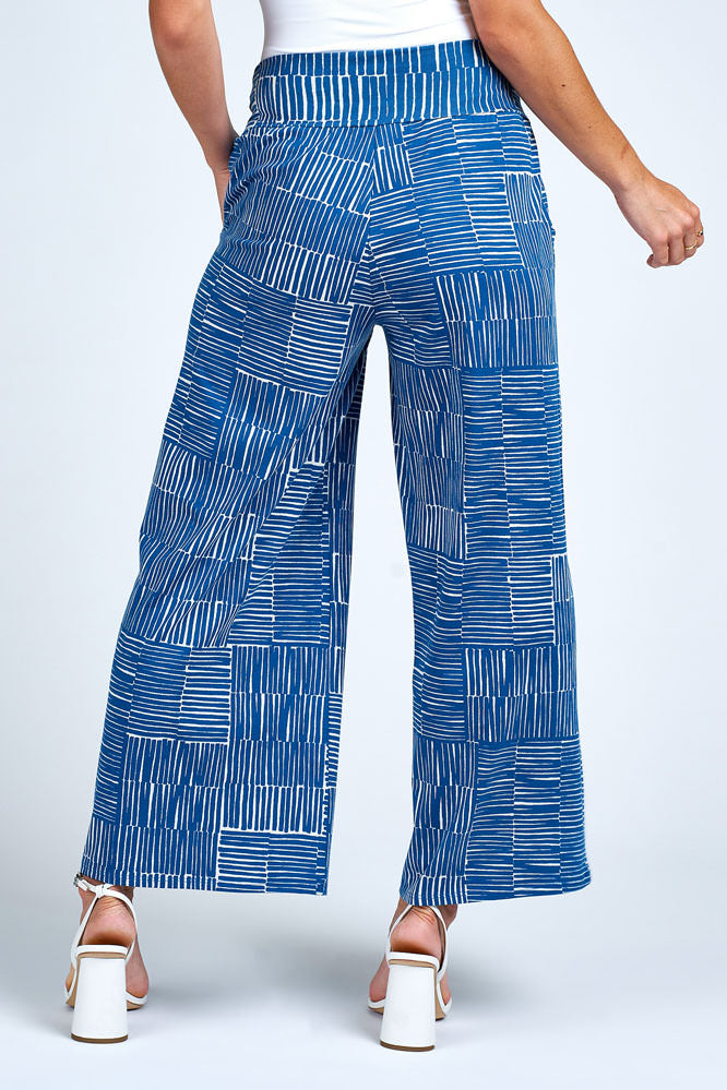 Woman wearing blue and white wide leg pant.