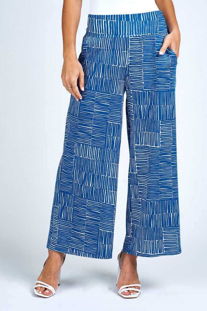 Woman wearing blue and white wide leg pant.
