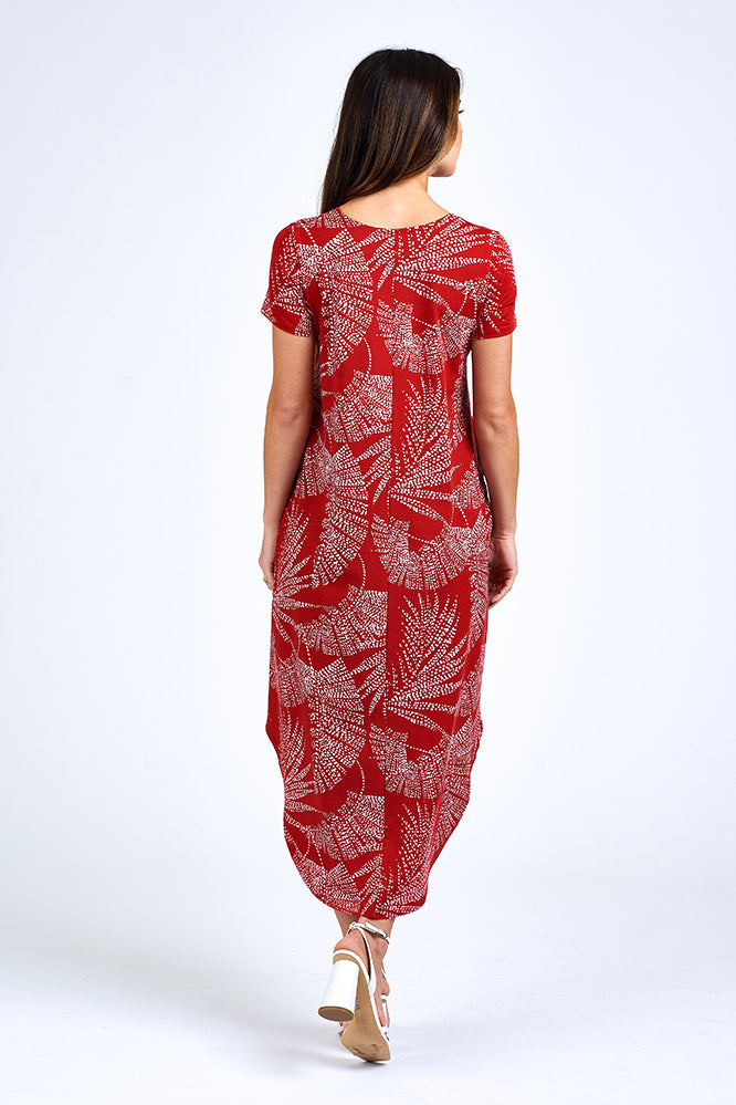 Woman wearing grey and red maxi dress.