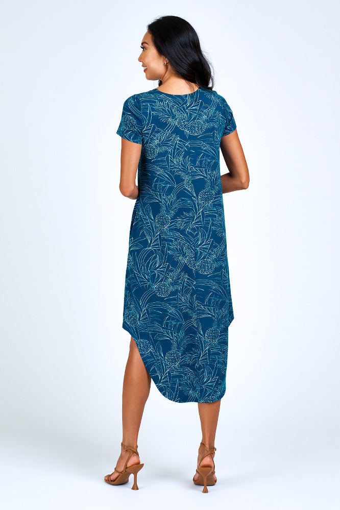 Woman wearing blue and cream maxi dress.