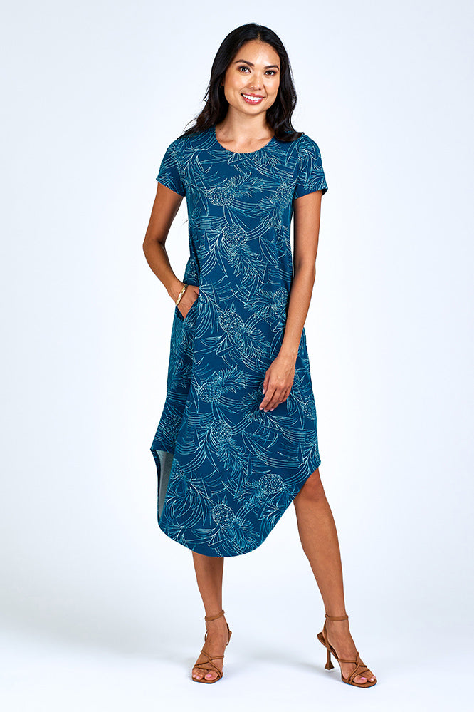 Woman wearing blue and cream maxi dress.