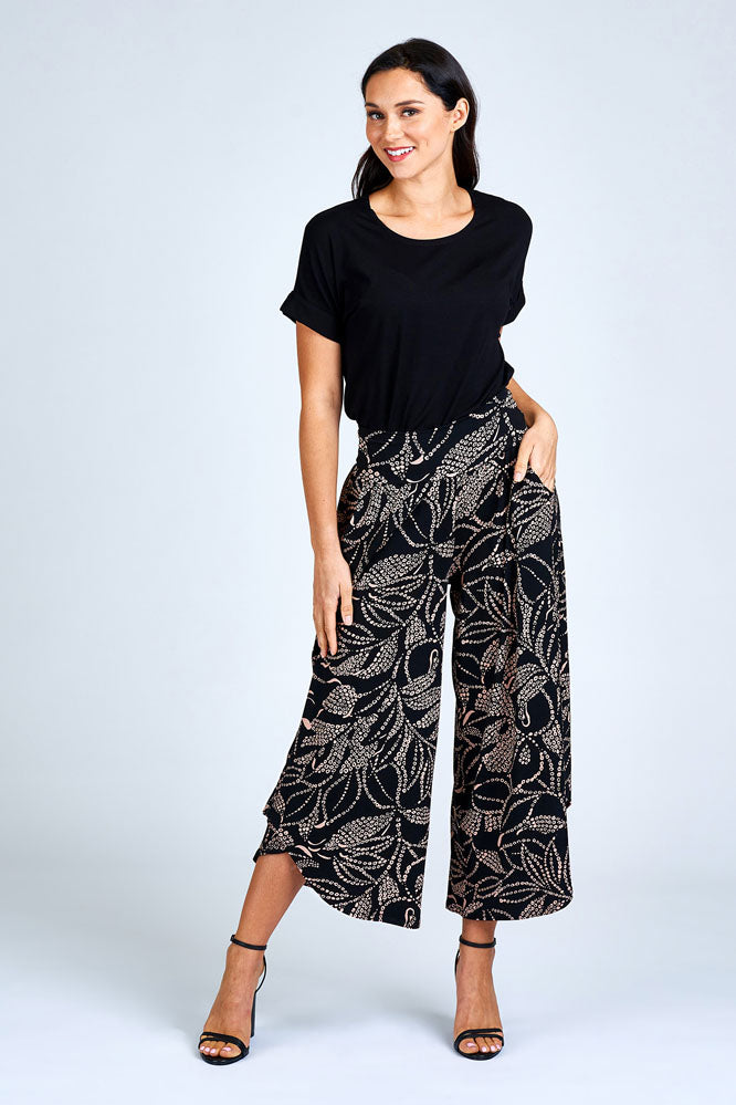Woman wearing black and cream pant.