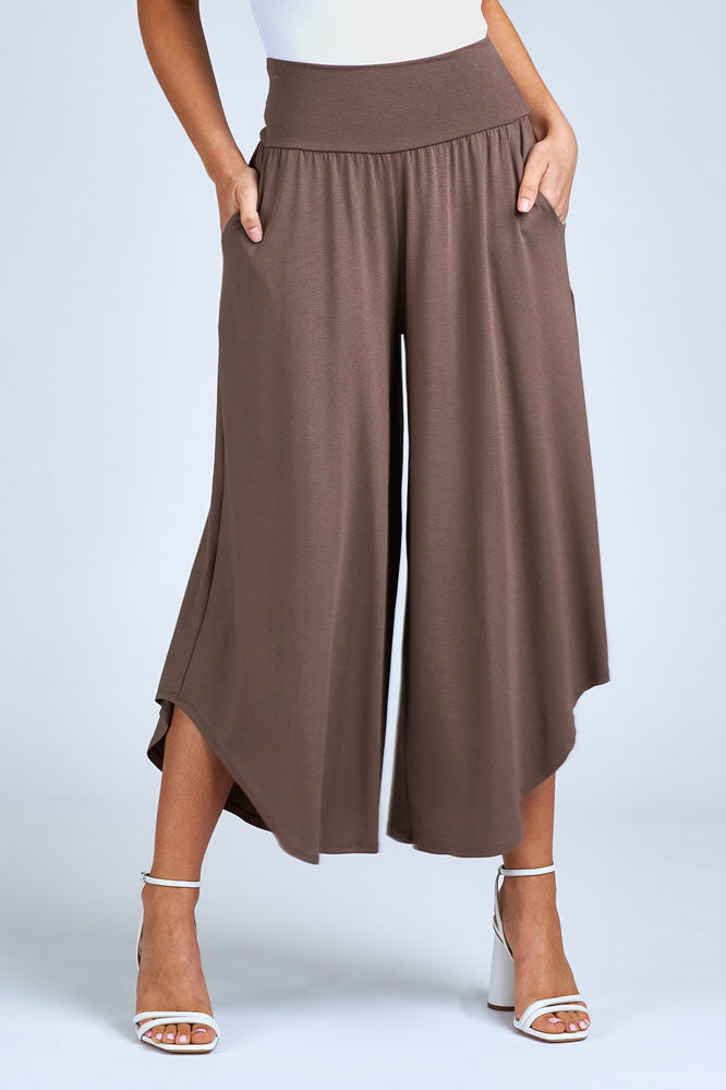 Woman wearing light brown pant.