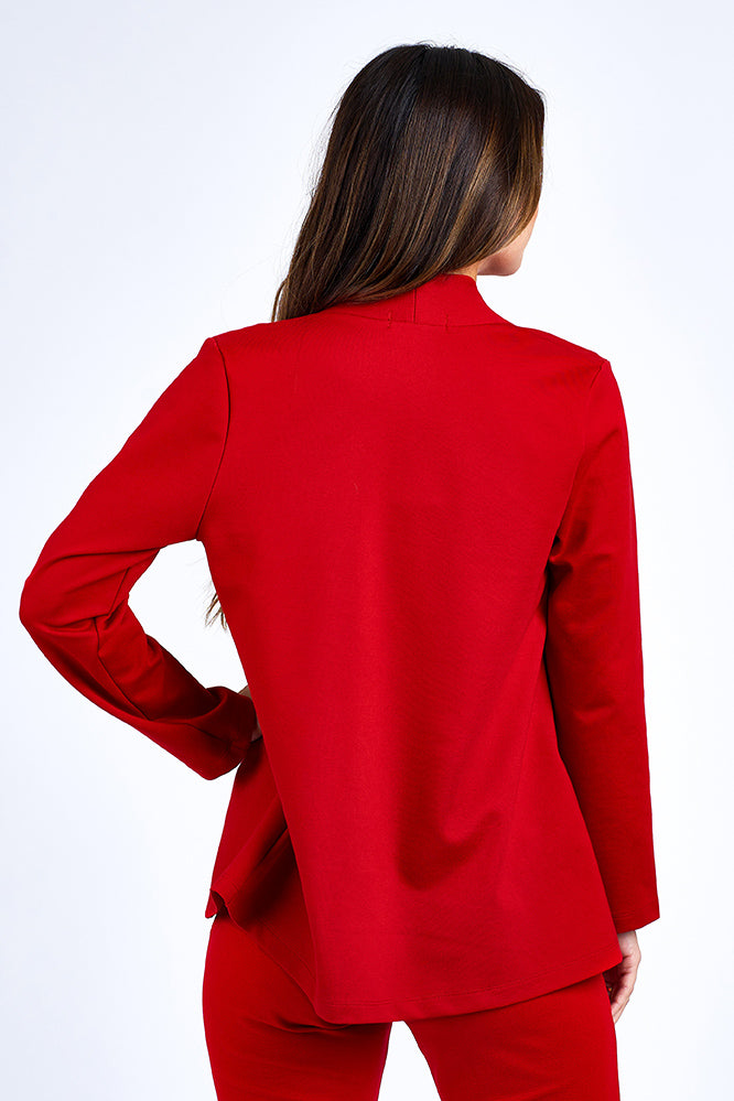Woman wearing red blazer.