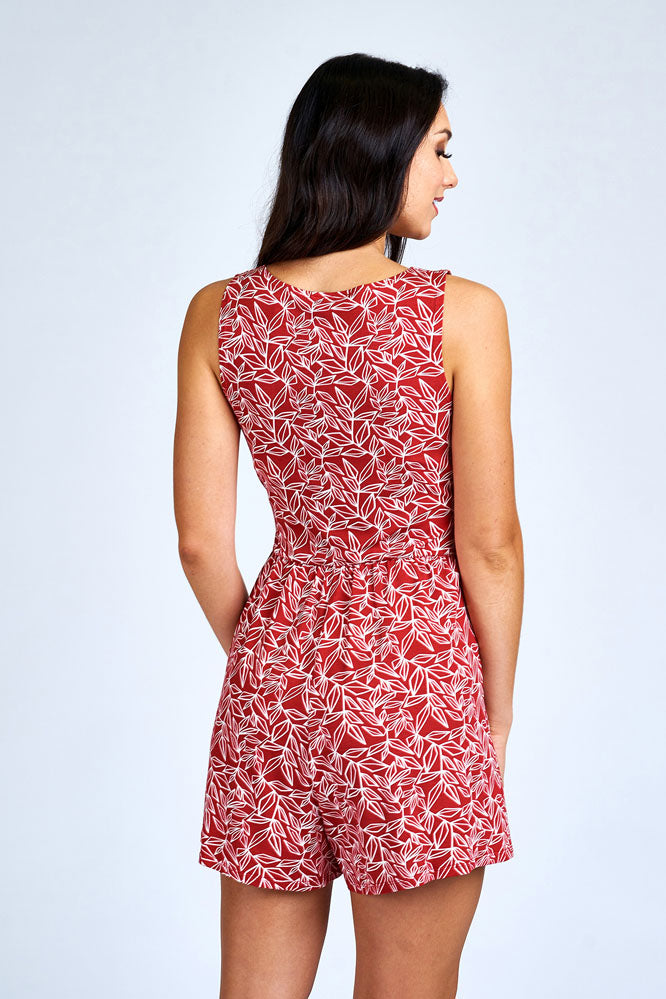 Woman wearing red romper.