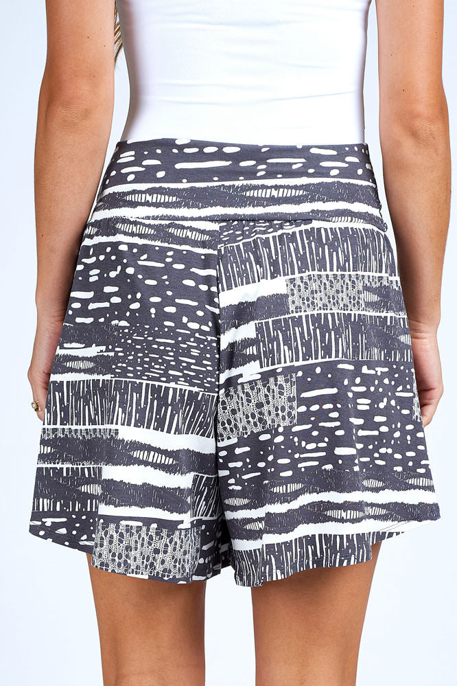 Woman wearing grey and white skort.