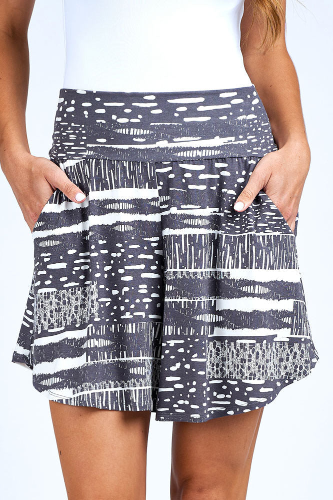 Woman wearing grey and white skort.