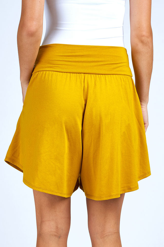 Woman wearing yellow skort.
