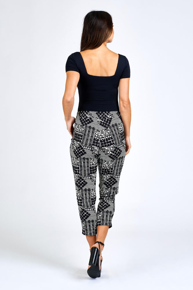 Woman wearing black and white print pants.