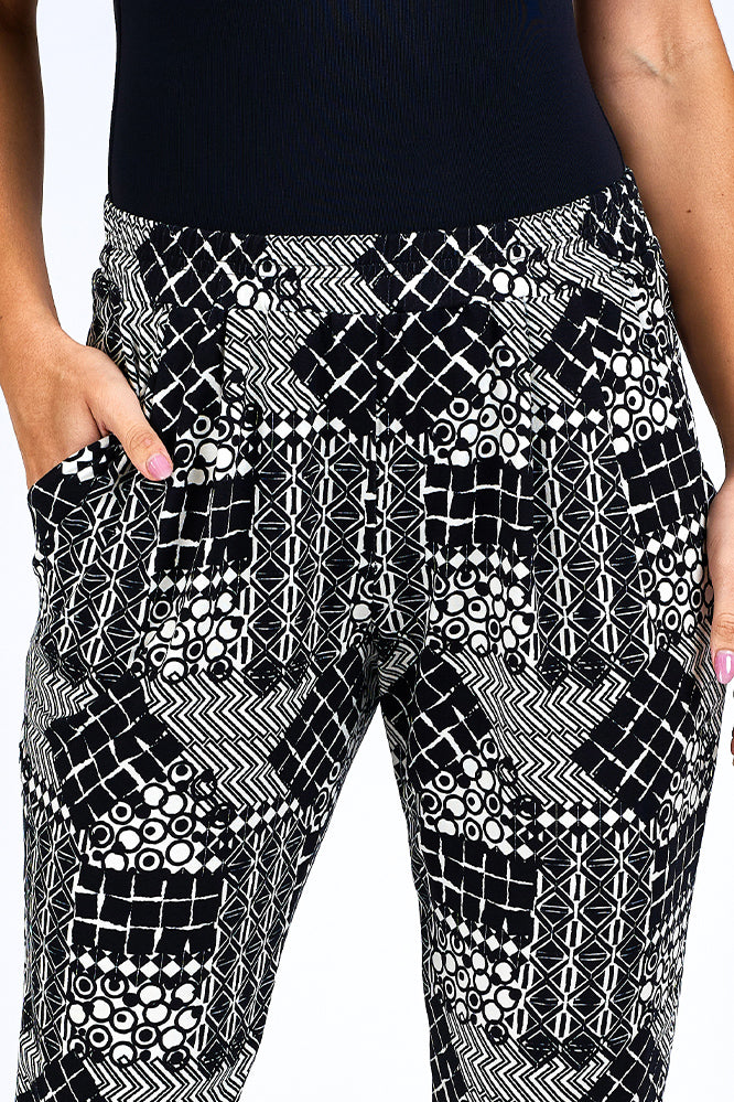 Woman wearing black and white print pants.