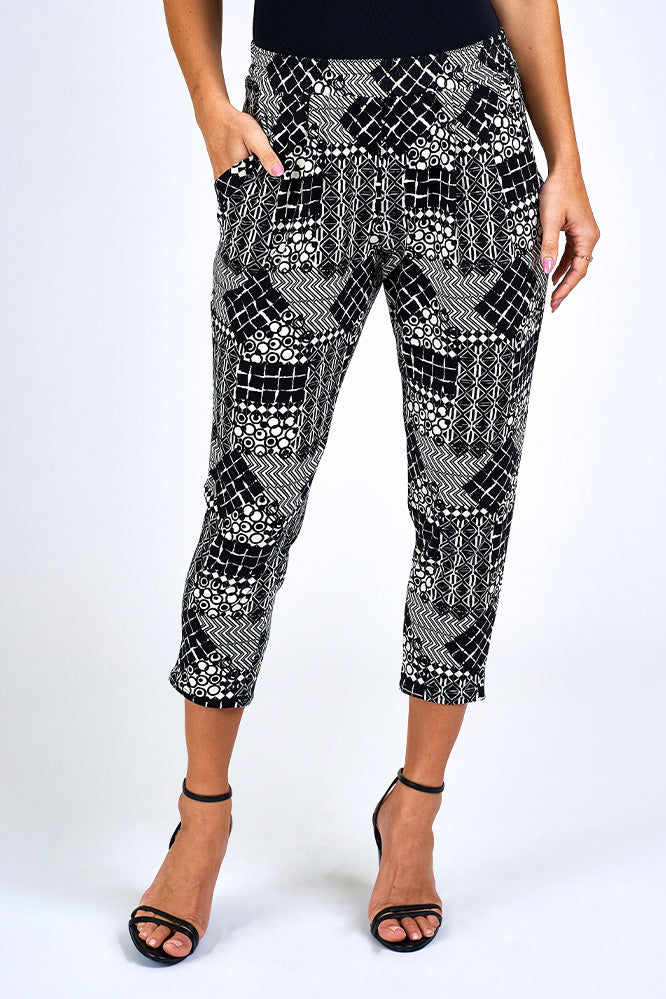 Woman wearing black and white print pants.