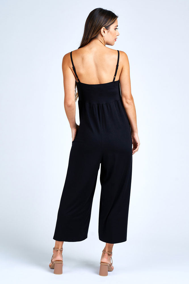 Woman wearing black jumpsuit.