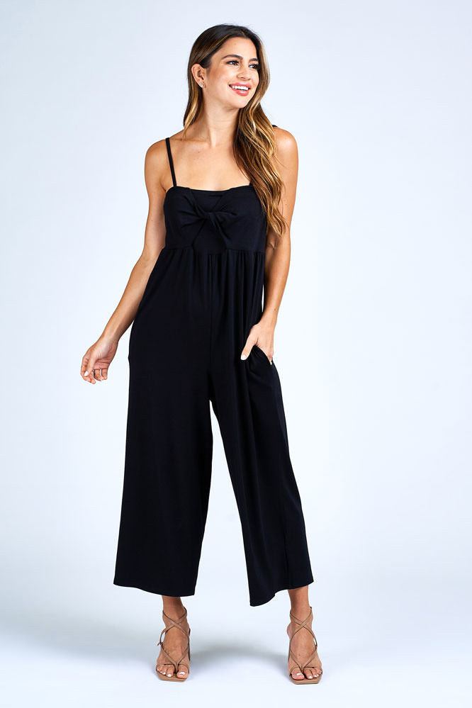 Woman wearing black jumpsuit.