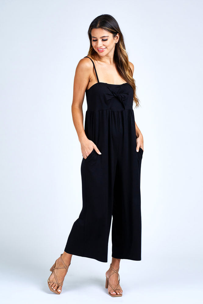 Woman wearing black jumpsuit.