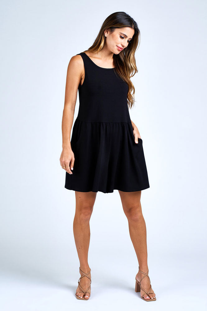 Woman wearing black romper.