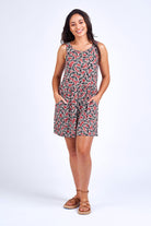 Woman wearing pink print dress.