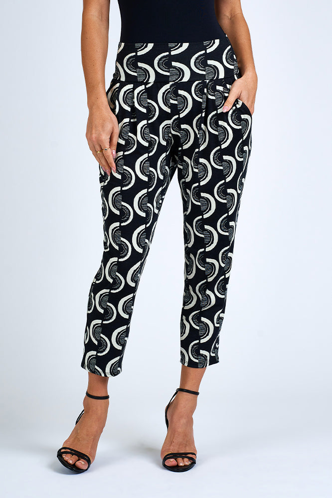 Woman wearing black and white pants.